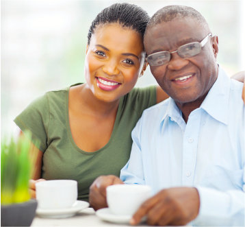 caregiver and senior man having a cup of tea