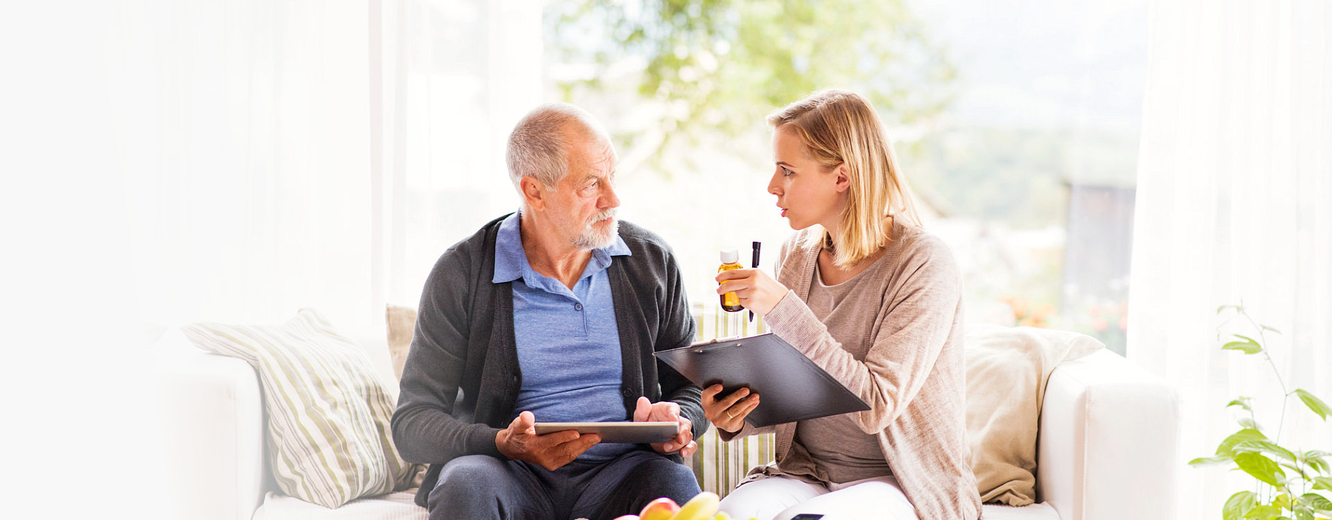 caregiver and senior woman having a conversation