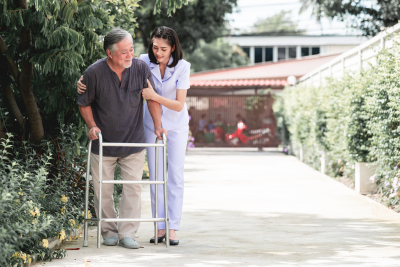 nurse assisting the senior man