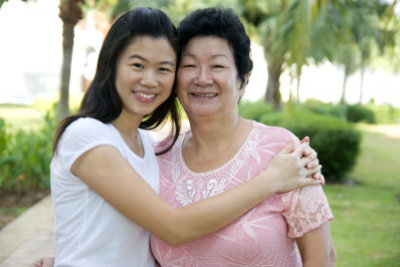 caregiver and senior woman are smiling